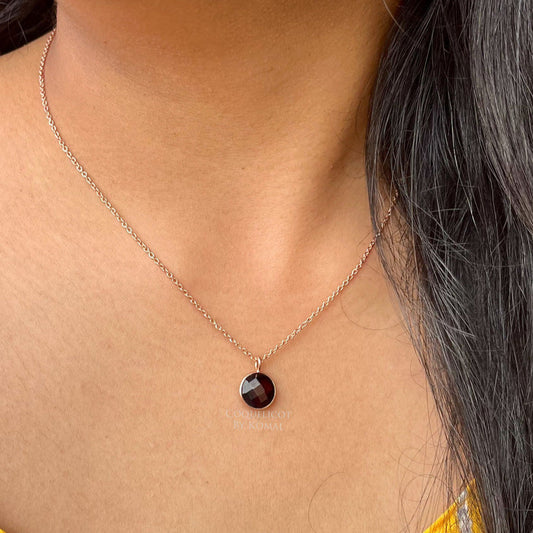 10mm round maroon Garnet pendant placed in a 18 inches chain with fine rose gold polish. Handcrafted jewellery that is a unique spiritual gift.