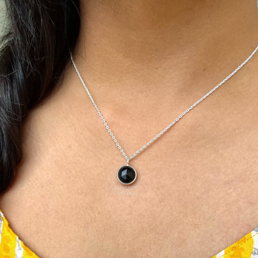 10mm round Black Obsidian pendant placed in a 18 inches chain with fine polish. Handcrafted jewellery that is a unique spiritual gift.