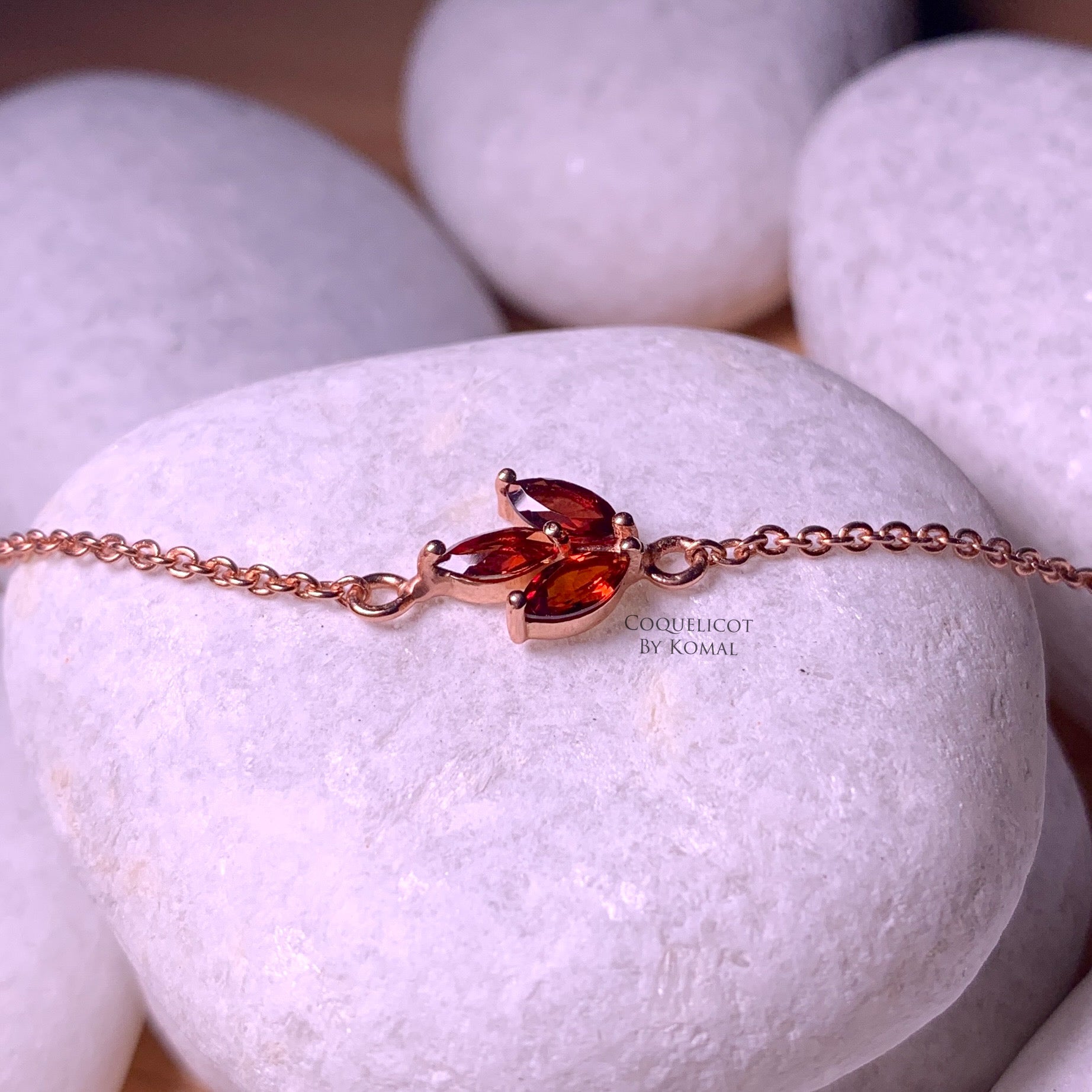 Money bag pendant garnet crystal bracelet necklace Stock Photo - Alamy