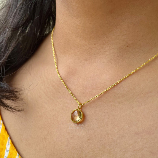 10mm round yellow Citrine pendant placed in a 18 inches chain with 18K Gold polish. Handcrafted jewellery that is a unique spiritual gift.
